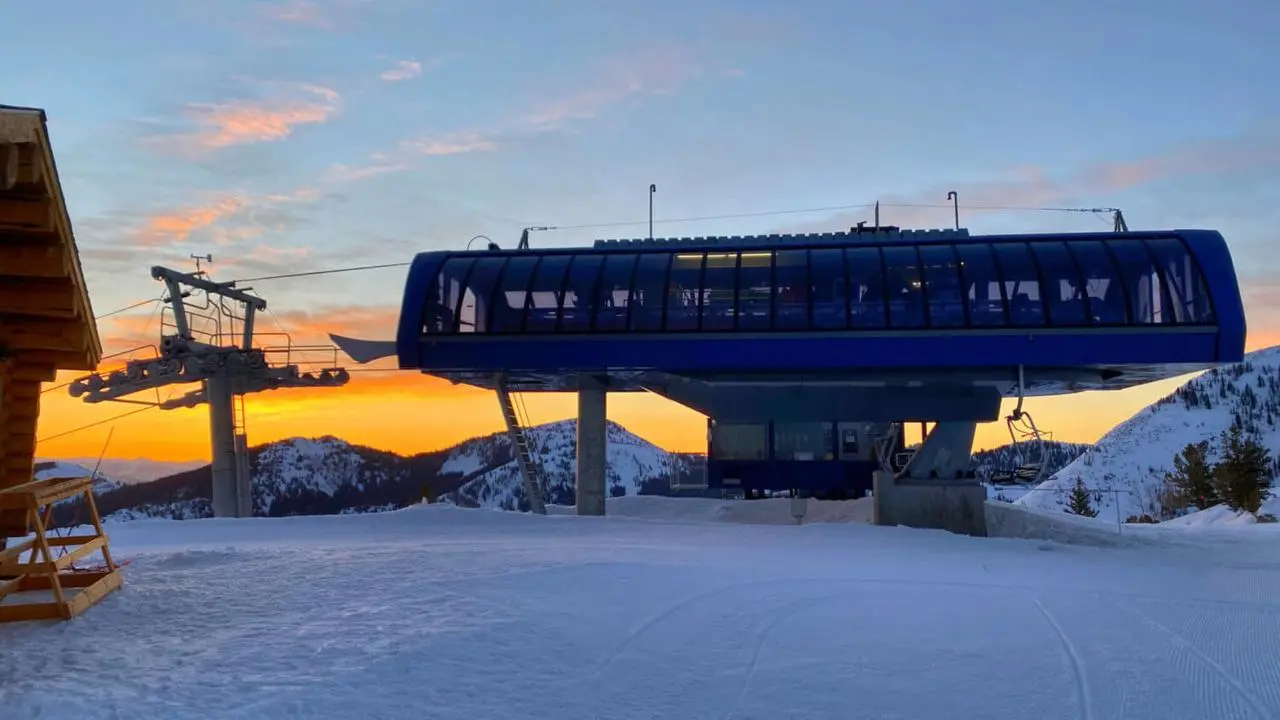 A ski chair lift at sunrise