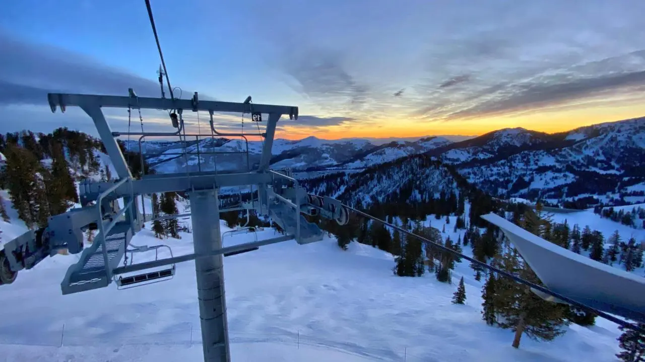 An aerial view from the top of a chair lift at sunrise